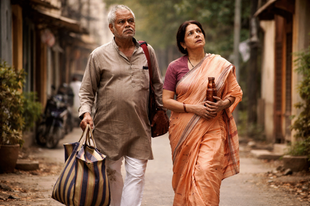 Vadh 2 फिल्म से प्रेरित AI जनरेटेड प्रतिनिधि इमेज, जिसमें संजय मिश्रा और नीना गुप्ता के किरदार गंभीर माहौल में आमने-सामने दिखाए गए हैंVadh 2 फिल्म से प्रेरित AI जनरेटेड प्रतिनिधि इमेज, जिसमें एक बुज़ुर्ग दंपति संजय मिश्रा और नीना गुप्ता के किरदार ग्रामीण रास्ते पर चलते हुए गंभीर भावनाओं के साथ दिखाए गए हैं