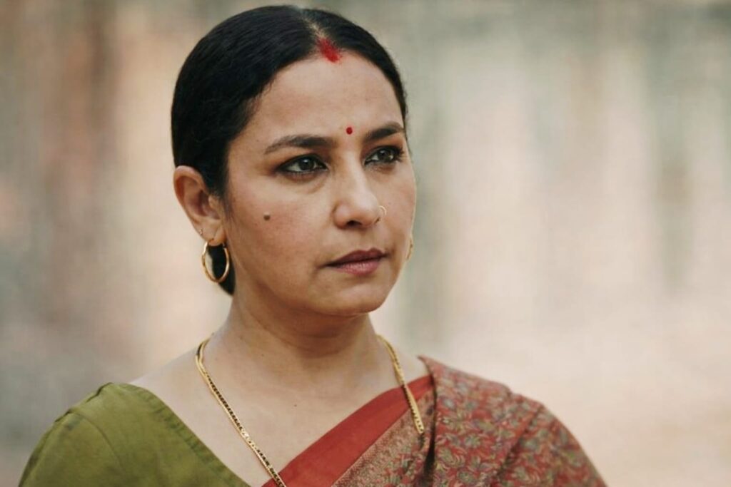 Divya Dutta closeup emotional look green red saree intense expression Bollywood actress

