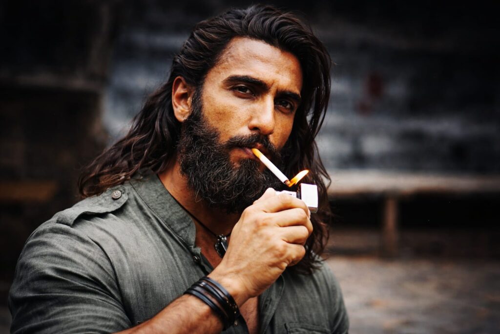 Ranveer Singh intense look in Dhurandhar The Revenge film with long hair and beard

