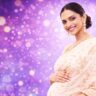 Deepika Padukone pregnancy pose in saree with studio background and soft lighting